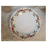 Four piece setting of Home Essentials Woodland Celebration dinnerware set.  Featuring snowman and holly branch patterns.