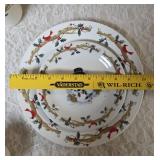 Four piece setting of Home Essentials Woodland Celebration dinnerware set.  Featuring snowman and holly branch patterns.