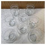 Eight piece vintage Anchor Hocking or Indianan Glass ruffled edge clear glass fish bowl, often used as a rose bowl or candle holder.
