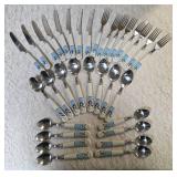 Service for Eight Cutlery  (knives, forks and spoons).  The handles feature snowmen.