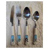 Service for Eight Cutlery  (knives, forks and spoons).  The handles feature snowmen.
