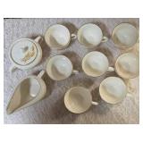 Vintage Homer Laughlin Golden Wheat set that includes a sugar bowl and creamer bowl and eight coffee cups. This set  likely produced in the 1950