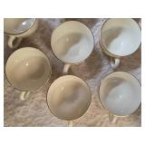 Vintage Homer Laughlin Golden Wheat set that includes a sugar bowl and creamer bowl and eight coffee cups. This set  likely produced in the 1950