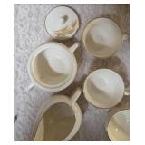 Vintage Homer Laughlin Golden Wheat set that includes a sugar bowl and creamer bowl and eight coffee cups. This set  likely produced in the 1950