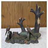 Three -Vintage Resin Figurines and 1 Pheasant on  Wagon Wheel Plate Holder.