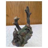 Three -Vintage Resin Figurines and 1 Pheasant on  Wagon Wheel Plate Holder.