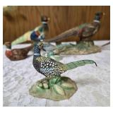 Three vintage collectible pheasant figurines made of ceramic or porcelain and three small pheasant figurines. Features hand painted details with a glossy finish.
