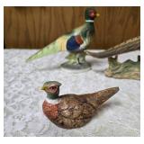Three vintage collectible pheasant figurines made of ceramic or porcelain and three small pheasant figurines. Features hand painted details with a glossy finish.