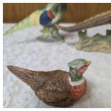 Three vintage collectible pheasant figurines made of ceramic or porcelain and three small pheasant figurines. Features hand painted details with a glossy finish.