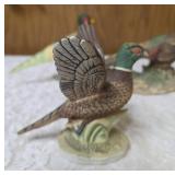 Three vintage collectible pheasant figurines made of ceramic or porcelain and three small pheasant figurines. Features hand painted details with a glossy finish.