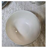 Vintage dinnerware set with 4 place settings is made by Thomson Pottery .  This set  is "Snowman Winterland Blue Sponge". Each place setting includes a dinner plate, salad plate, bowl and a mug.