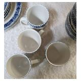 Vintage dinnerware set with 4 place settings is made by Thomson Pottery .  This set  is "Snowman Winterland Blue Sponge". Each place setting includes a dinner plate, salad plate, bowl and a mug.