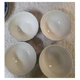 Vintage dinnerware set with 4 place settings is made by Thomson Pottery .  This set  is "Snowman Winterland Blue Sponge". Each place setting includes a dinner plate, salad plate, bowl and a mug.