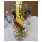 Hazel-Atlas Ice bucket and  8 glasses.   The glasses and Ice Bucket feature a 22K gold aim and detailed red, black and gold pheasant designs.