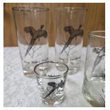 Five vintage barware glasses from the Federal Glass "Sportsman" Game Bird series, which typically features wildlife graphics and silver or gold rims.
