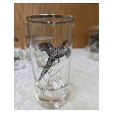 Five vintage barware glasses from the Federal Glass "Sportsman" Game Bird series, which typically features wildlife graphics and silver or gold rims.