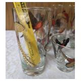 Eight vintage set of Hazel Atlas glassware in the Pheasant pattern, commonly found as part of Mid-Century Modern (MCM) barware sets and 3 shot glasses. Features flying pheasants in red, black and gold