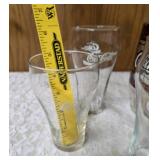 Four Vintage Coco-Cola glasses and Coca-Cola Tiffany-style stained glass Pitcher.