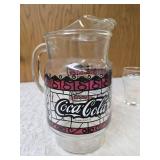 Four Vintage Coco-Cola glasses and Coca-Cola Tiffany-style stained glass Pitcher.