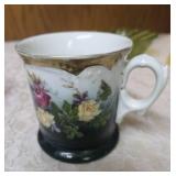 Collection of Decorative items.  Green glass vase, Angel figurine  and small Angel with a bell,  Green Acrylic Bowl and Vintage Bavarian Floral patterned teacup.