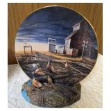 Terry Redland.  Two Terry Redland plate holders  with Two Terry Redland plates. The plates are "Country Road" and "Prairie Skyline".