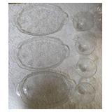 Vintage dishes: Mikasa Christmas Woods Canape Tray, Hazel Atlas vintage leaf-shaped clear glass relish or candy dish , vintage Anchor Hocking clear pressed glass snack tray featuring a grapevine and l