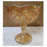 Vintage Imperial Carnival Glass compote or candy dish in a marigold (iridescent orange) color featuring a pedestal base and a "Hobstar and Arches" pattern. 7 to 8" tall.