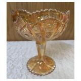 Vintage Imperial Carnival Glass compote or candy dish in a marigold (iridescent orange) color featuring a pedestal base and a "Hobstar and Arches" pattern. 7 to 8" tall.