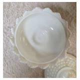Vintage Fenton hobnail milk glass set features a lidded compote or candy dish and a matching smaller bowl .  The smaller bowl is 2 1/2" Tall.  Popular throughout the mid-20th century.