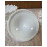 Vintage Fenton hobnail milk glass set features a lidded compote or candy dish and a matching smaller bowl .  The smaller bowl is 2 1/2" Tall.  Popular throughout the mid-20th century.