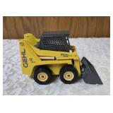 1/25 scale diecast model of a Gehl 4835 skid loader. The brand is Joal and the Manufacturer is Die-Cast Promotions (DCP) or NZG.