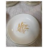 Complete -Place setting for fifteen, dinner plate,  salad plate, soup bowl, coffee plate. Set of "Homer Laughlin Golden Wheat" dinnerware, featuring 22k gold trim and a wheat stalk pattern.
