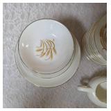 Misc. pieces -20 Dinner plates,12  salad plates, 1 saucer, 1 dessert plate , 1 gravy bowl, 17 coffee plates, 4 bread bowls.  Set of "Homer Laughlin Golden Wheat" dinnerware, featuring 22k gold trim an