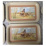 Seven vintage TV dinner trays or snack trays, likely manufactured in the 1950