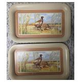 Seven vintage TV dinner trays or snack trays, likely manufactured in the 1950
