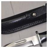 Buck 119 USA w/Black Leather Sheath