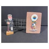 Three-Piece Display Lot: Figurine in Wire Basket & Native American Headdress Brick Plaque and Carved Wooden Capatin