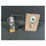 Three-Piece Display Lot: Figurine in Wire Basket & Native American Headdress Brick Plaque and Carved Wooden Capatin