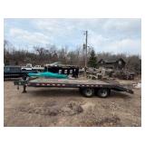 1989 Tandem-axle flatbed equipment trailer
