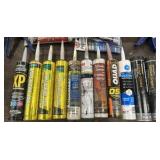 Caulk and caulk guns