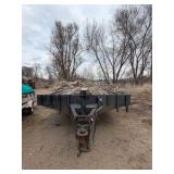 1989 Tandem-axle flatbed equipment trailer