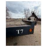 1989 Tandem-axle flatbed equipment trailer