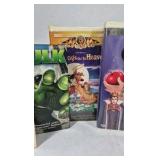 Assorted VHS movies including Disney titles Snow White, Bambi, Monsters Inc, and Hercules along with Hulk. Mixed family and animated films in standard VHS cases shown.