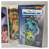 Assorted VHS movies including Disney titles Snow White, Bambi, Monsters Inc, and Hercules along with Hulk. Mixed family and animated films in standard VHS cases shown.