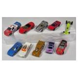 Mixed die cast cars including race cars, police vehicles, trucks, and dragsters. Various colors, styles, and themes with Hot Wheels and Matchbox type models.