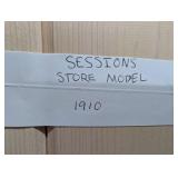 Sessions Store Model 1910 Wall Clock - Carved Oak Case, Brass Dial, 2-Wind Time/Strike