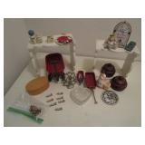 White stands and trinkets...