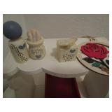 White stands and trinkets...