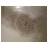 Crochet needles, thread and coaster...