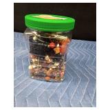 Jar of jewelry and jewelry pieces